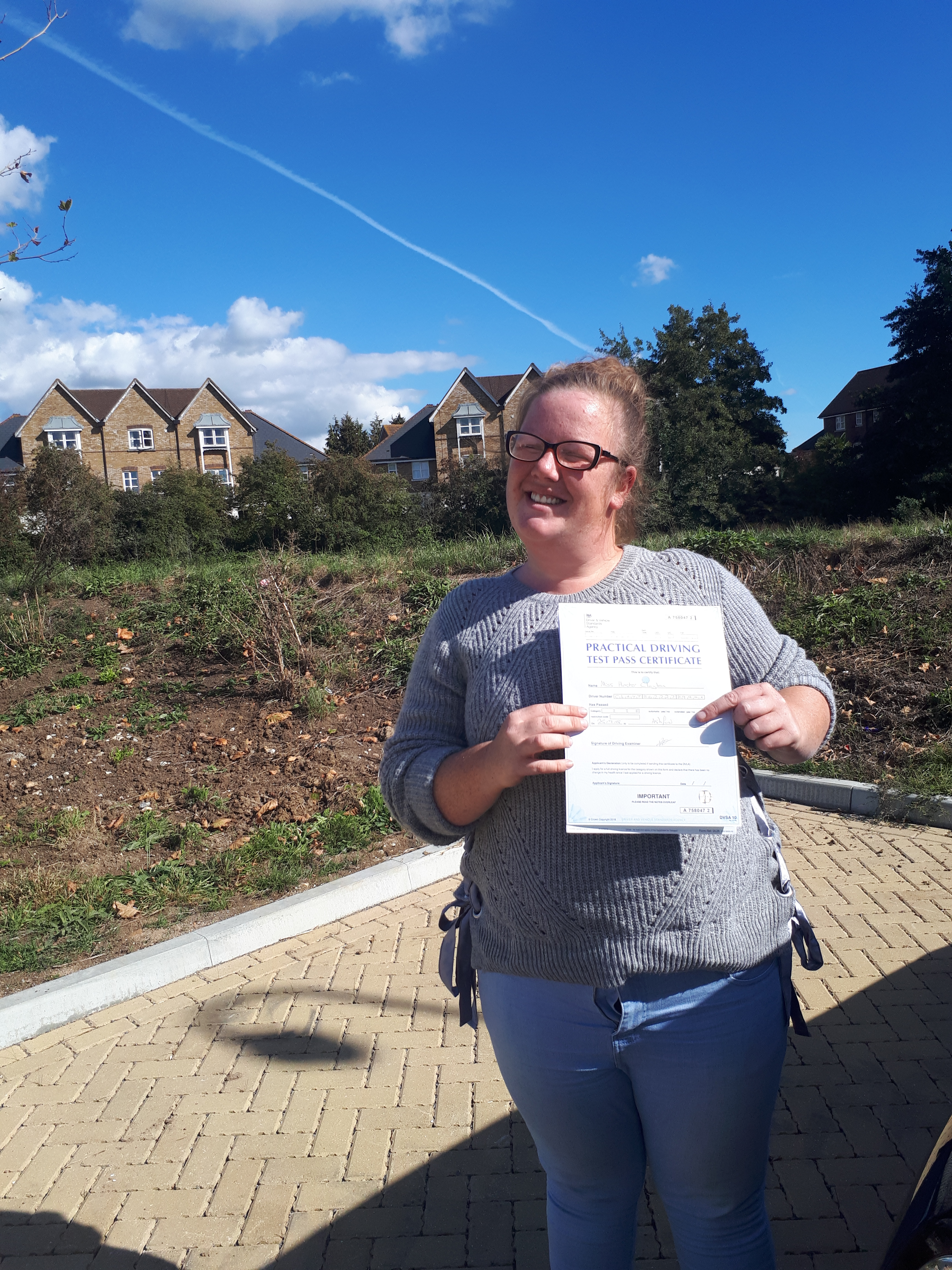 Hester with pass certificate after passing her driving test at Ashford kent test centre